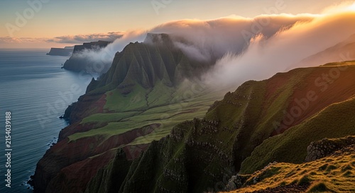 Dramatic Coastal Cliffs with Golden Hour Clouds and Ocean Mist at Sunrise