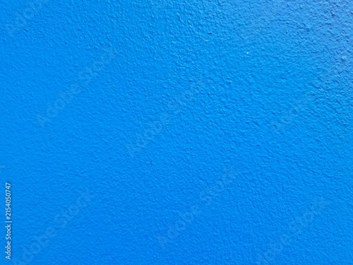 Vibrant Blue Texture: A close-up, high-angle view showcases a textured, vivid blue surface, offering a simple yet striking visual.