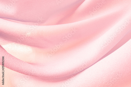 Obraz na plátně Wavy pink silk chiffon fabric abstract background, closeup