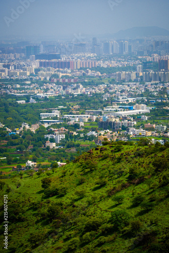 Photography Pune city panorama with industrial growth, concrete expansion, and green landsca