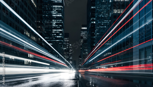 Low Angle View Of Modern Downtown Avenue With High Speed Red And White Light Trails
