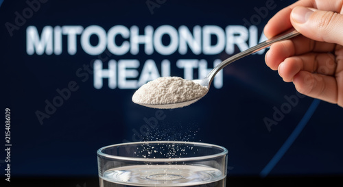 Biohacking longevity research supplement powder in spoon over glass of water for health
