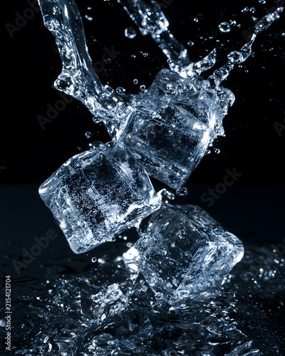 Dynamic Splash: High-Speed Capture of Ice Cubes Colliding with Water in an Exquisite Display of Motion and Crystal Clarity Against a Dark Background