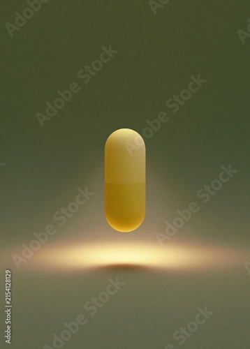 Digital illustration of a single yellow capsule. the capsule is in the center of the image and is the only object in the frame. it is oval-shaped and appears to be made of a smooth, glossy material.