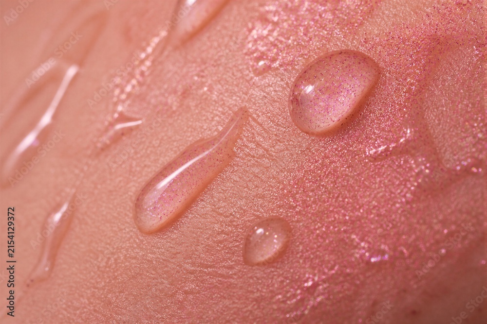 Fototapeta premium Skin with moisturizing droplets and glossy shimmer closeup macro