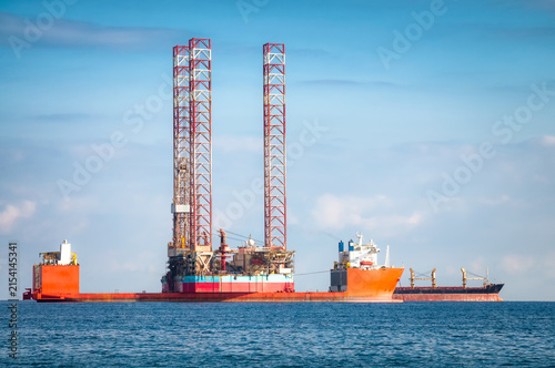 Offshore Jack-Up Oil Rig Transported by Heavy Lift Vessel at Sea
