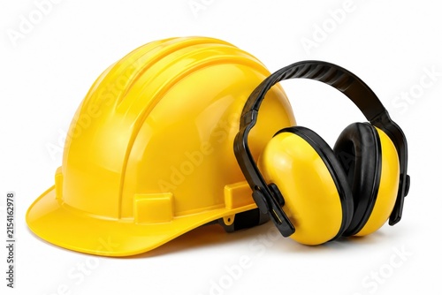 Yellow construction hard hat and protective earmuffs for safety gear