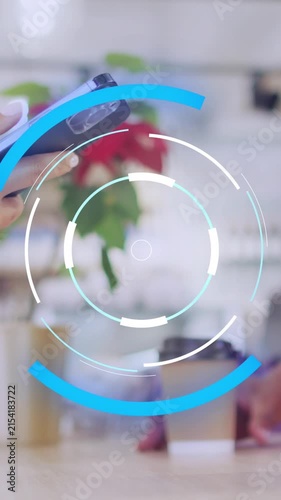 Animation of scope scanning over diverse shop assistant and customer paying with smartphone