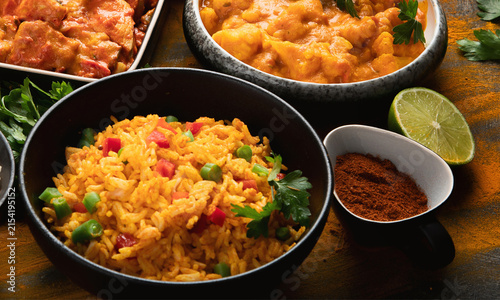 Indian Chicken Curry with Steamed Rice and Fresh Vegetables, Spicy Gourmet Meal Served Hot in a Bowl, Delicious Traditional Cuisine Closeup
