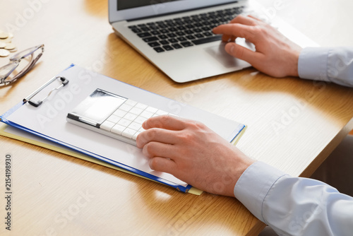 Person calculating finances...