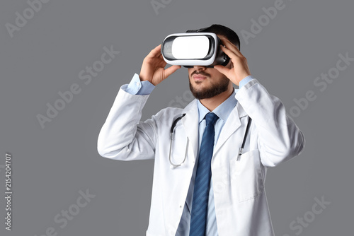 Male doctor in VR glasses o...