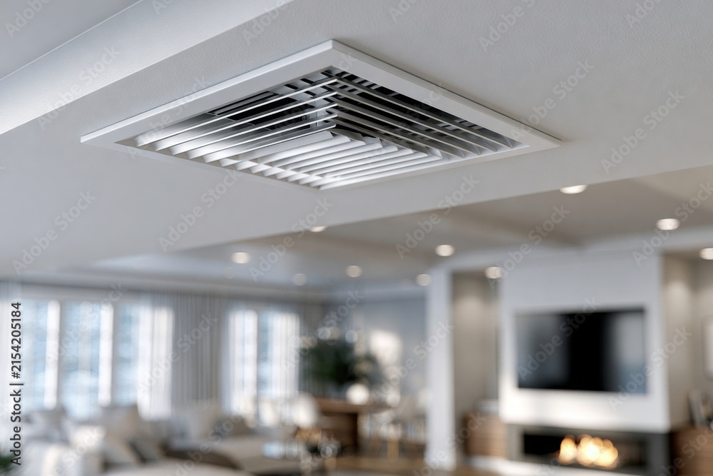 Fototapeta premium Modern white ceiling air vent in a bright living room with large windows and a fireplace creating a cozy and comfortable atmosphere
