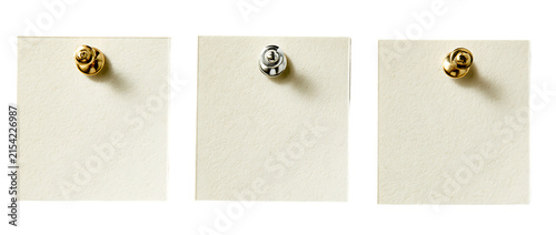Four blank rectangular vintage paper notes attached with different metal pushpins on a transparent background
