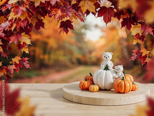 Two cute white teddy bear figurines sitting on a wooden pumpkin display surrounded by vibrant red and orange maple leaves in a blurred autumn forest setting during a sunny fall afternoon