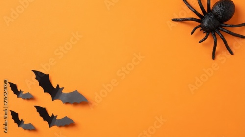 Halloween flat lay composition with plastic spiders and bats