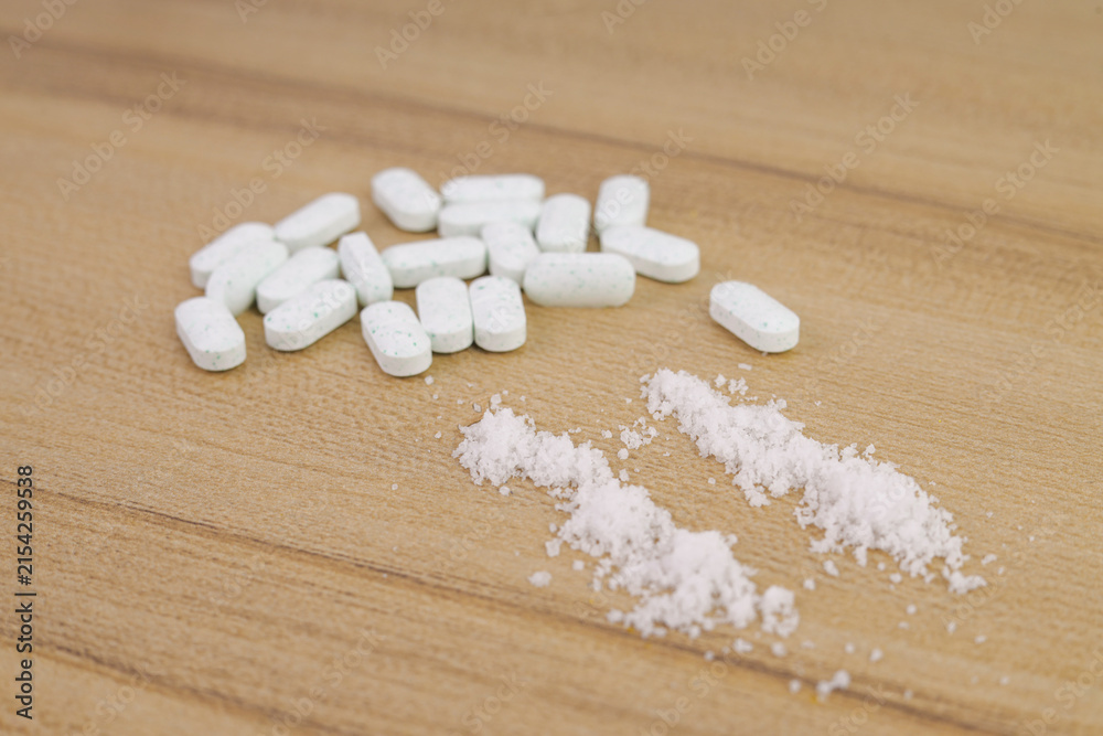 Fototapeta premium Close Up of Crushed Powder Lines and Oval Medical Tablets