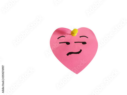 Pink heart shaped sticky note with a funny smirk face
