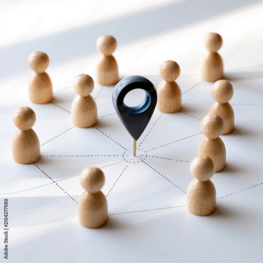 Obraz premium Concept of community connection and central location with wooden figures linked by dotted lines around a location marker on white surface