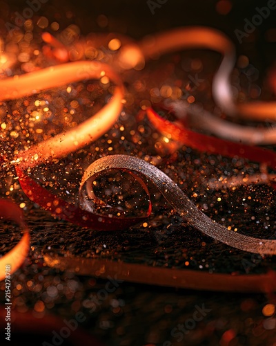 Glittering ribbons and sparkling dust create a festive, magical, and celebratory atmosphere