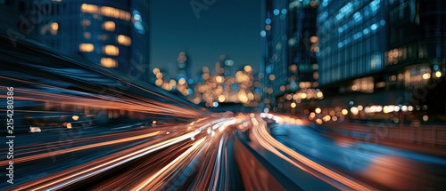 Streaking lights of a city at night, creating motion blur