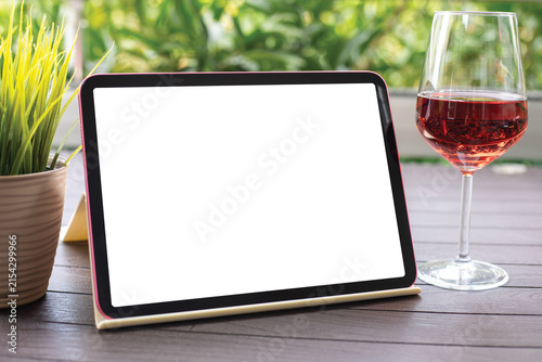 Computer tablet with isolated screen background table glass wine cafe