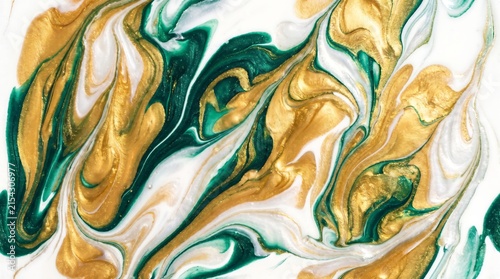 Abstract background with swirling liquid paint in metallic gold and emerald green colors
