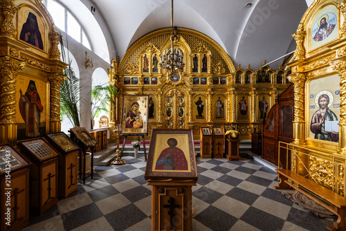 View of the ornate golden iconostasis and religious icons inside the historic Solovetsky Monastery in Solovetsky, Arkhangelsk Oblast, Russia.