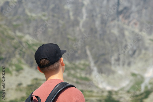 Obraz na plátně teenager looking away at high tatras lomnicky stit mountain peak wearing black c