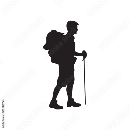Hiker with Backpack and Trekking Pole Walking on an Outdoor Adventure
