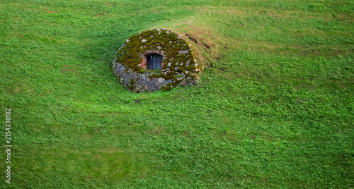 Mossy stone structure of the historic bunker creates a hidden shelter
