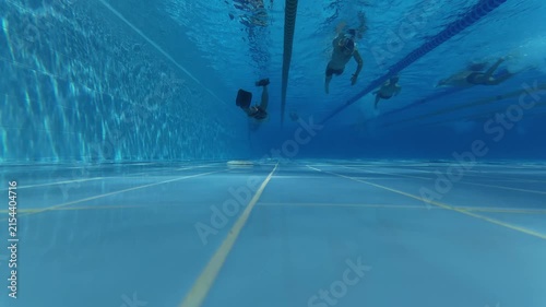 Underwater View of Swimmer in Flippers Swimming in Pool