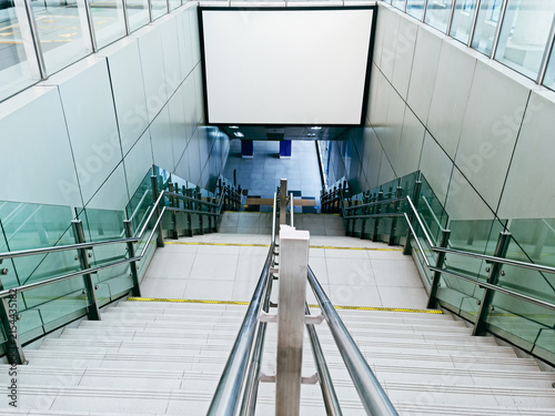 Blank billboard mockup on modern subway station staircase for advertisement