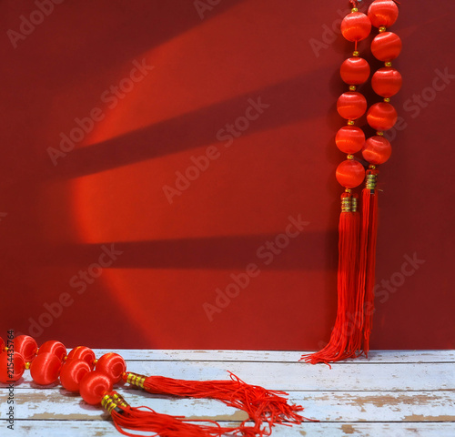 Fotografie Traditional Chinese New Year red background with lucky Chinese knot tassels and