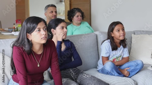 Family Laughing Together During Cozy Sunday Gathering at Home