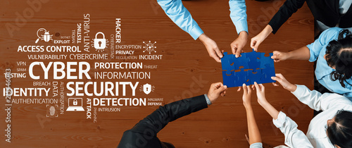 Фотография A diverse team collaborates creatively, piecing together a puzzle that symbolizes their commitment to enhancing cyber security and protecting sensitive information from digital threats