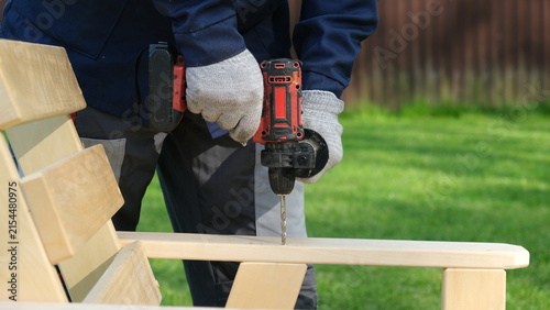 Konstfotografi Builder worker using cordless hammer drill