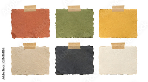 Colorful torn paper notes with tape for creative organization.