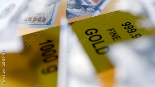 Принти на полотні A 3d torn US dollar bills floating around a gold bullion bar, metaphor for inflation, fiat currency vulnerability, and the enduring security of physical gold investments