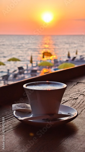 Cappuccino Coffee during sunset in a beach bar in Montenegro