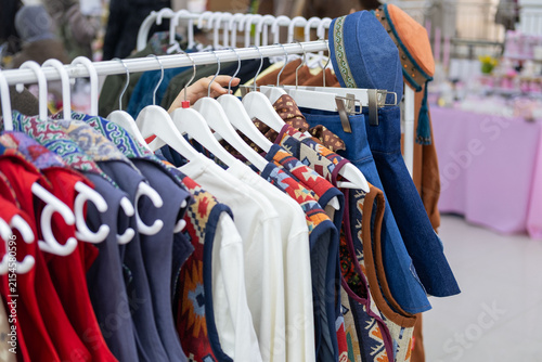 Quadro su tela Modern clothing inspired by Kazakh asian traditional culture, featuring ethnic patterns, colorful garments and a traditional Kazakh skullcap in a contemporary fashion setting