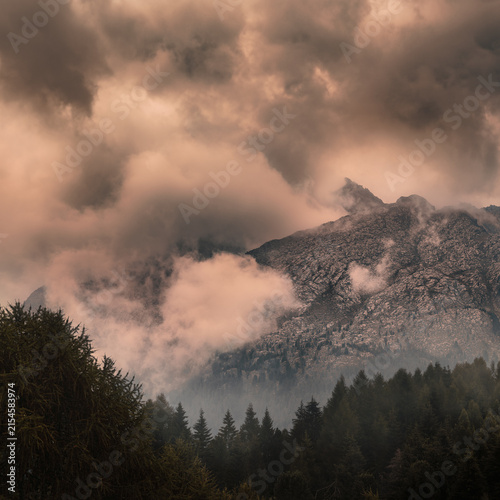 Dramatic Mountain Peaks Swirled in Fog and Sepia Clouds