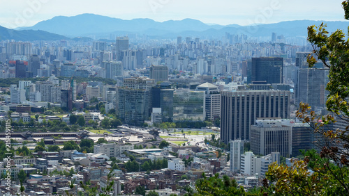 Aerial view of Seoul cityscape showing the harmony of traditional Gyeongbokgung Palace and modern skyscrapers