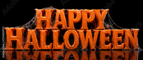 Happy Halloween covered in spider webs