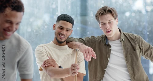 Diverse male friends leaning on cues, laughing sparking shooter lining up cue playing billiards