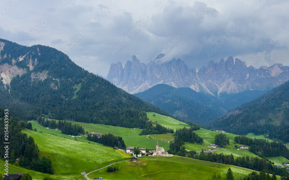 Obraz premium Landscape village Santa Maddalena in mountain valley at sunset in Dolomites, Italy. St. Magdalena and mountains. Val di Funes