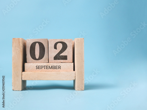 Принти на полотні A wooden block calendar for September 2nd on a light blue background