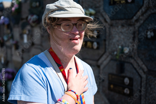 Woman mourning at grave in Tienen cemetery