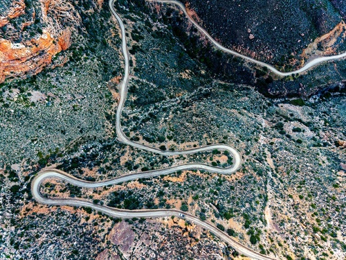 Aerial view of mountain pass with dirt road