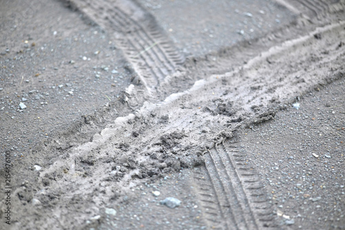 car tire tracks on the ground