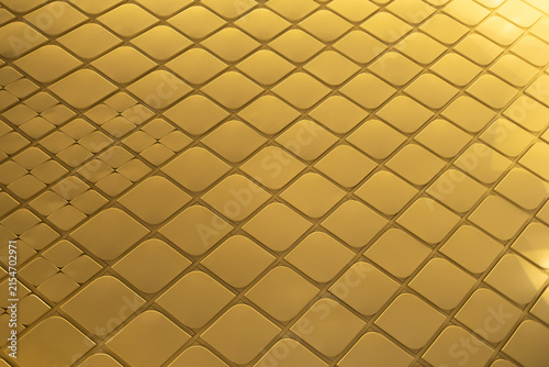 Perspective view of Abstract modern architectural detail featuring shiny golden diamond pattern tiles with metallic light reflection.